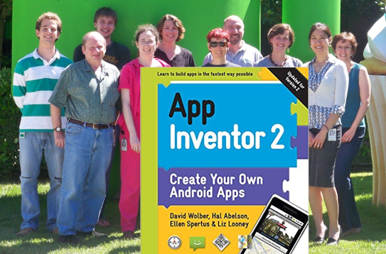 10 people posing in front of Android sculpture and cover of book App Inventor 2 by David Wolber, Hal Abelson, Ellen Spertus & Liz Looney